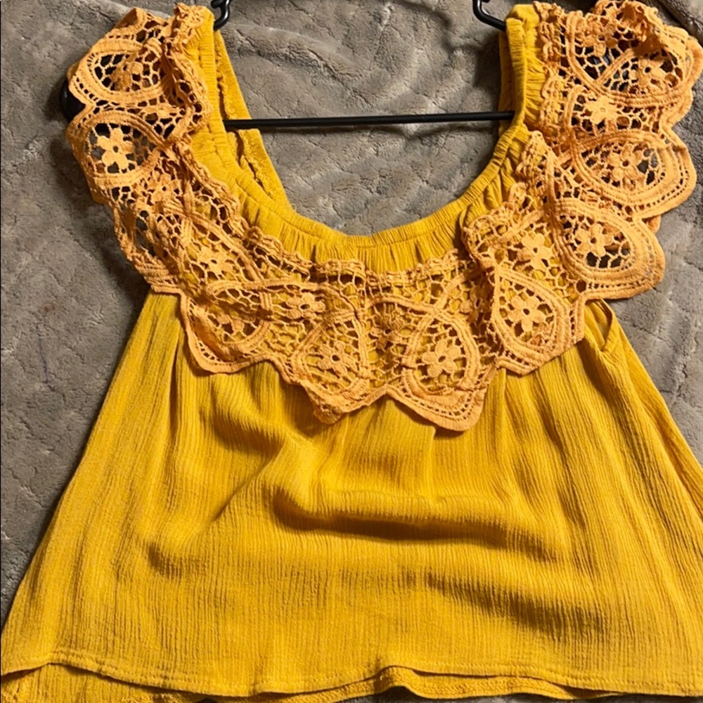 Bright yellow flowy top